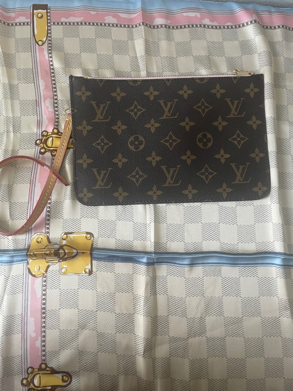 Monogram wristlet with soft pink interior